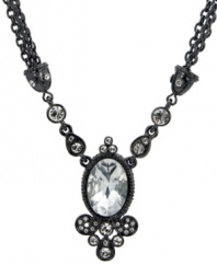 Showstopping style. As the ultimate finishing touch for your special occasion style, T Tahari's Crystal Elegance necklace features a hand-faceted crystal surrounded by dazzling crystal accents. With a double-chain silhouette, it's made in nickel-free hematite tone mixed metal. Approximate length: 18 inches + 3-inch extender. Approximate drop: 1-1/2 inches.