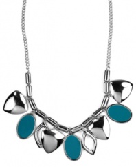 A colorful infusion. Nine West's pretty necklace features leaf-shaped charms and teal enamel ovals for a bright pop of color. Set in silver tone mixed metal. Approximate length: 16 inches + 2-inch extender. Approximate drop length: 1 inch. Approximate drop width: 5-3/4 inches.